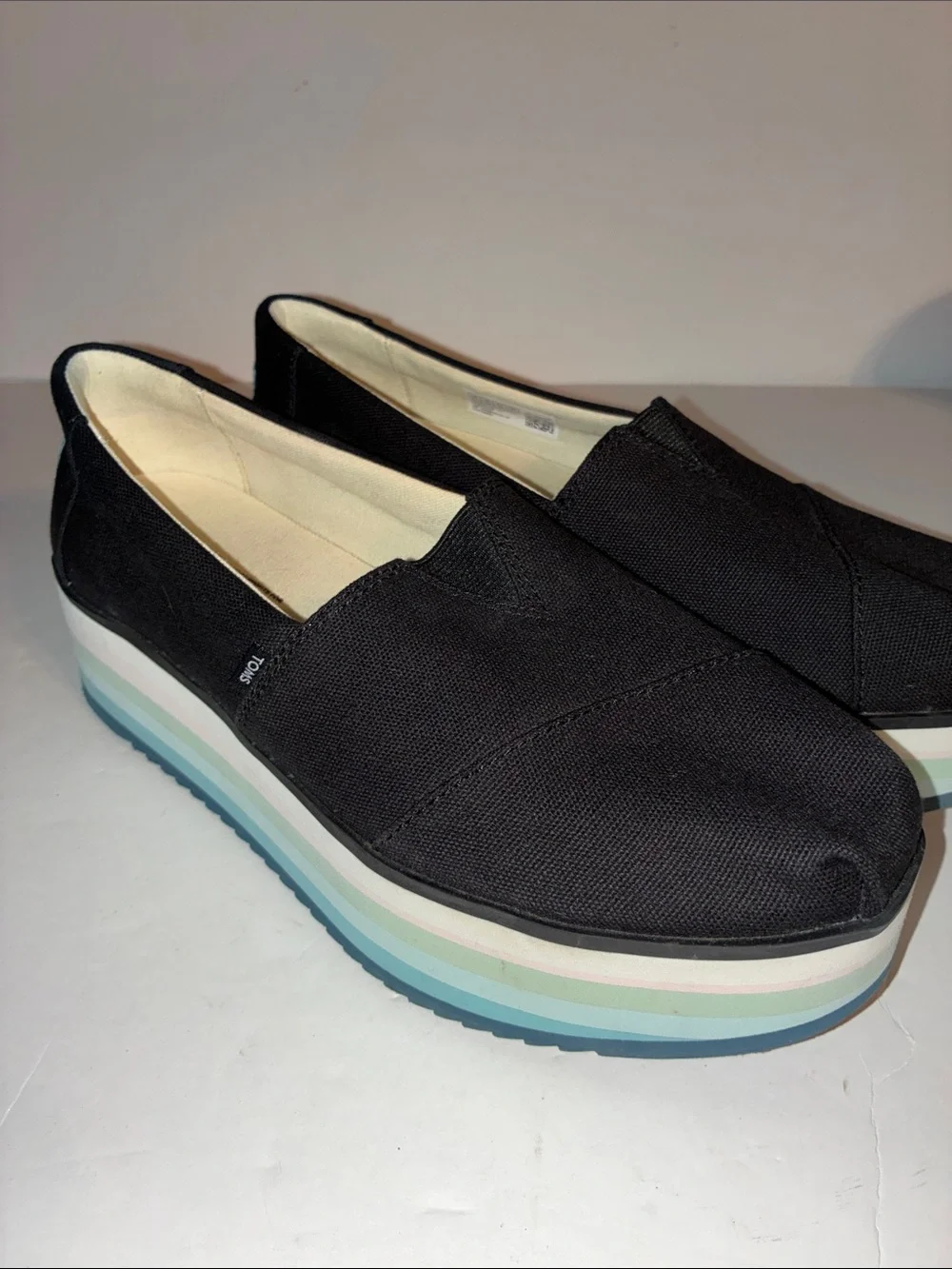 TOMS, Women’s 8.5, Black Canvas Platform Slip-Ons with Pastel Striped Sole